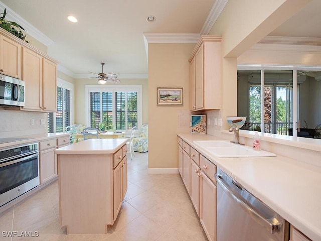 2325 Mont Claire Dr Unit 201, Naples, FL 34109 - kitchen with plenty of natural light, light countertops, stainless steel appliances, and light brown cabinets