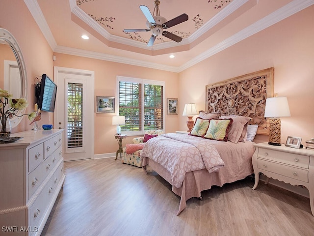 2325 Mont Claire Dr Unit 201, Naples, FL 34109 - bedroom with crown molding, light wood finished floors, access to outside, and a raised ceiling