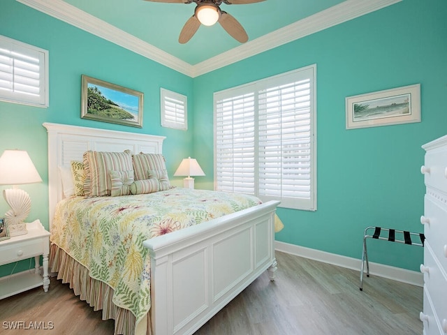 2325 Mont Claire Dr Unit 201, Naples, FL 34109 - bedroom featuring baseboards, ornamental molding, a ceiling fan, and light wood-style floors