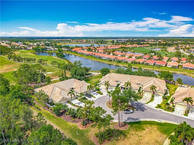 aerial overview of property's location with nearby suburban area, a nearby body of water, and a golf course