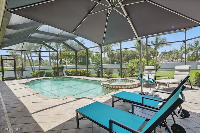 view of pool with a lanai, a pool with connected hot tub, and a patio area