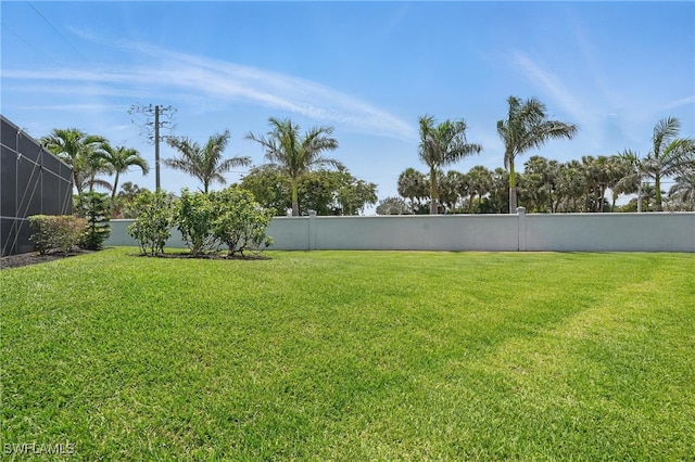 view of yard with a fenced backyard