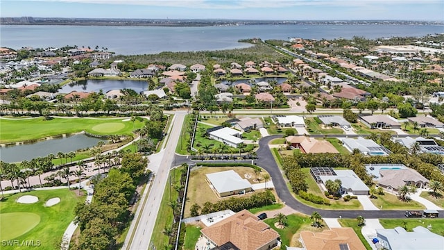 birds eye view of property with a water view, a residential view, and golf course view