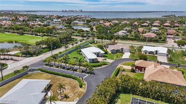 aerial view with a water view, a residential view, and golf course view