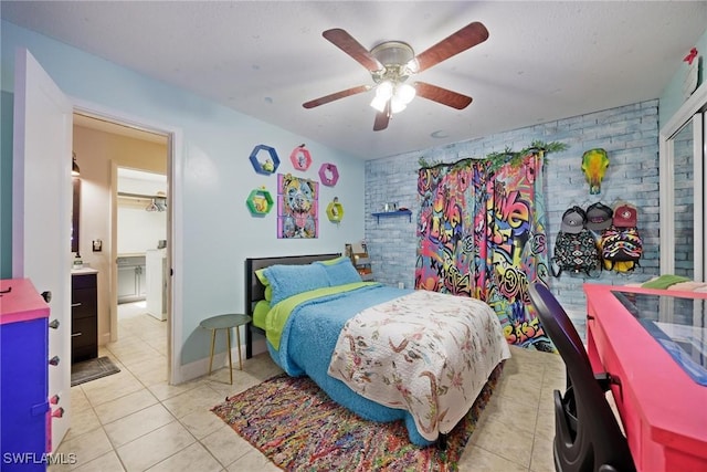 bedroom featuring brick wall, light tile patterned flooring, and a ceiling fan