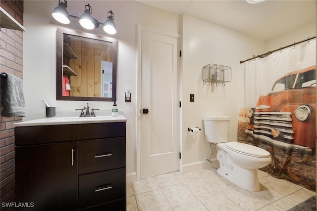 full bath with tile patterned flooring, vanity, baseboards, and toilet