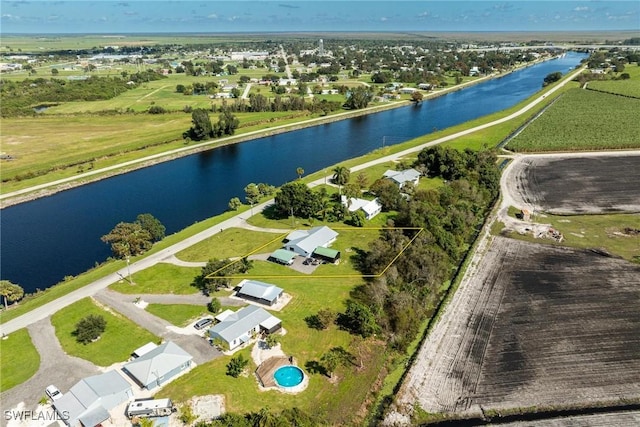 birds eye view of property featuring a residential view and a water view