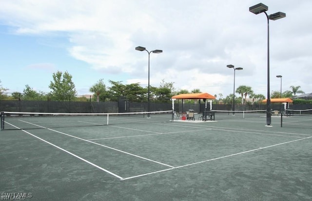 12125 Via Cercina Dr, Bonita Springs, FL 34135 - view of sport court featuring fence