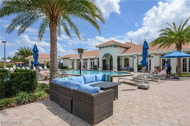 12125 Via Cercina Dr, Bonita Springs, FL 34135 - view of patio with an outdoor living space and a community pool