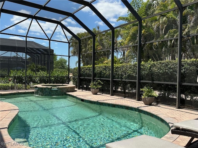 12125 Via Cercina Dr, Bonita Springs, FL 34135 - view of pool with glass enclosure, a pool with connected hot tub, and a patio