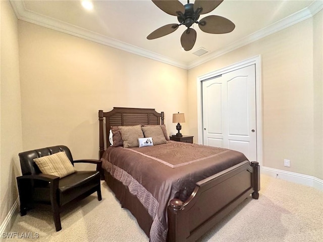12125 Via Cercina Dr, Bonita Springs, FL 34135 - bedroom featuring a closet, light carpet, baseboards, ornamental molding, and visible vents
