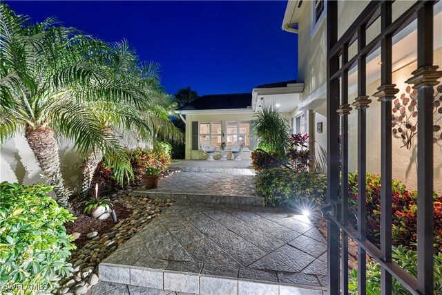 3098 Greenflower Ct, Bonita Springs, FL 34134 - view of patio at twilight