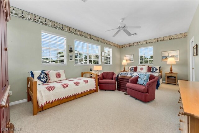 3098 Greenflower Ct, Bonita Springs, FL 34134 - bedroom with carpet flooring, multiple windows, baseboards, and ceiling fan