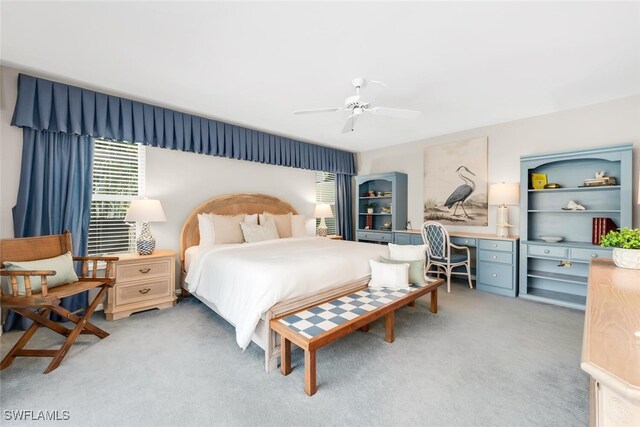 3098 Greenflower Ct, Bonita Springs, FL 34134 - bedroom with light colored carpet, an office area, and a ceiling fan