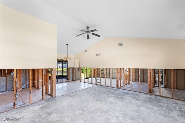 6181 Plumosa Ave, Fort Myers, FL 33908 - unfurnished living room featuring high vaulted ceiling, unfinished concrete floors, visible vents, and ceiling fan with notable chandelier