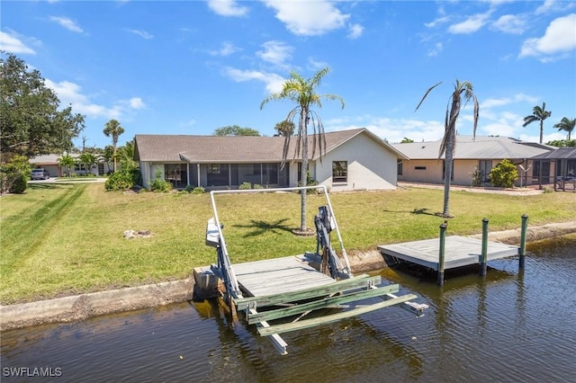 6181 Plumosa Ave, Fort Myers, FL 33908 - dock area with a lawn, boat lift, and a water view