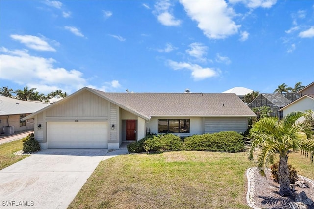 6181 Plumosa Ave, Fort Myers, FL 33908 - ranch-style home featuring a front yard, an attached garage, central AC, and concrete driveway
