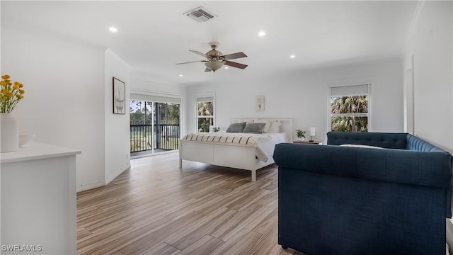2920 24th Ave SE, Naples, FL 34117 - bedroom with access to outside, multiple windows, visible vents, and light wood-style flooring