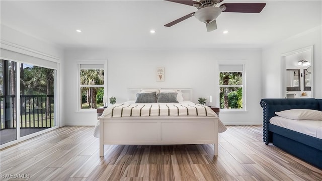 2920 24th Ave SE, Naples, FL 34117 - bedroom featuring access to outside, multiple windows, and light wood finished floors