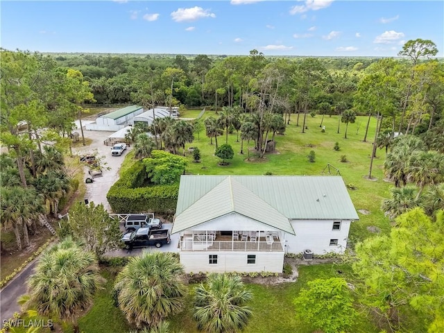 2920 24th Ave SE, Naples, FL 34117 - drone / aerial view featuring a wooded view