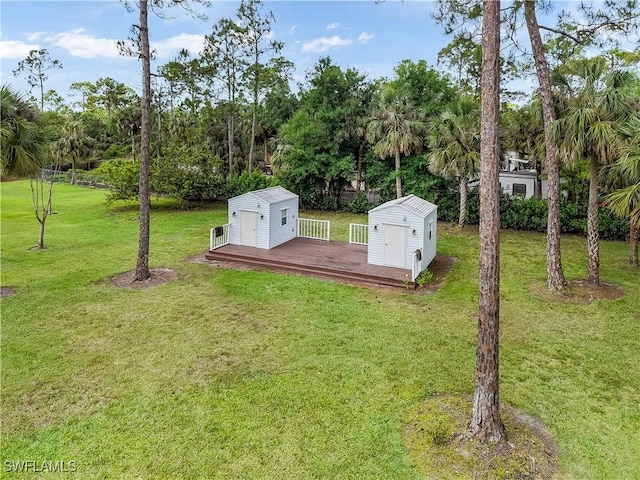 2920 24th Ave SE, Naples, FL 34117 - view of storm shelter with an outdoor structure, a yard, and a shed