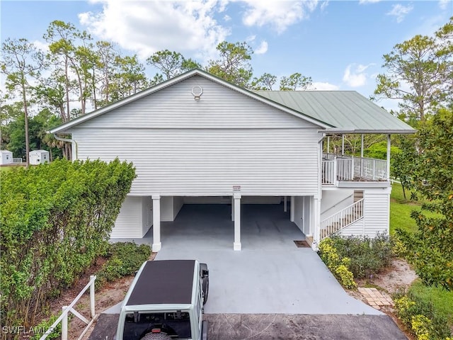 2920 24th Ave SE, Naples, FL 34117 - view of side of property featuring driveway and a carport