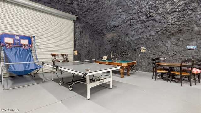 2920 24th Ave SE, Naples, FL 34117 - playroom featuring concrete floors and pool table