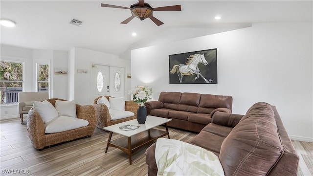2920 24th Ave SE, Naples, FL 34117 - living area with lofted ceiling, a ceiling fan, visible vents, and light wood-type flooring