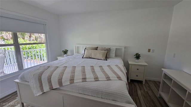 2920 24th Ave SE, Naples, FL 34117 - bedroom with baseboards, wood finished floors, and multiple windows
