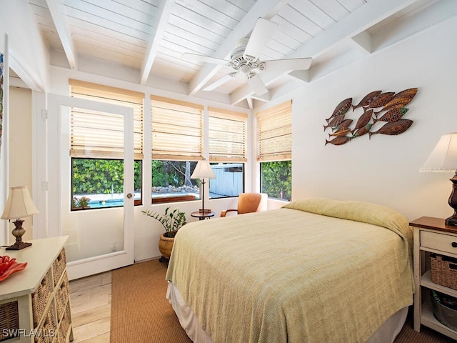1055 8th Ave N, Naples, FL 34102 - bedroom with beamed ceiling, light wood finished floors, and a ceiling fan