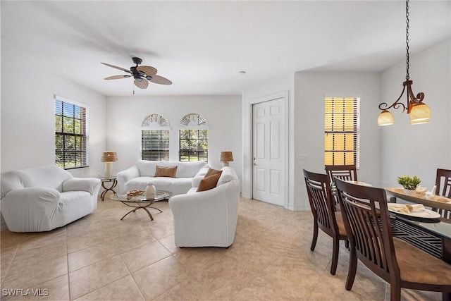 9134 Chula Vista St Unit 125, Naples, FL 34113 - living area with light tile patterned floors and a ceiling fan