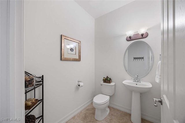 9134 Chula Vista St Unit 125, Naples, FL 34113 - bathroom with toilet, tile patterned flooring, and baseboards