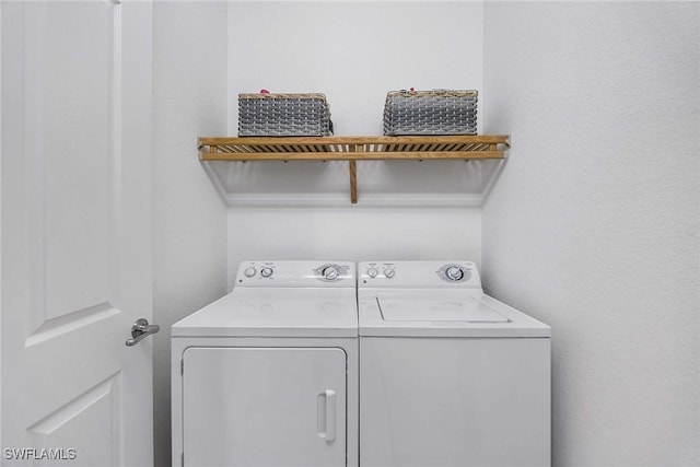 9134 Chula Vista St Unit 125, Naples, FL 34113 - laundry area with washer and dryer and laundry area