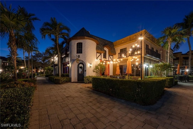 9134 Chula Vista St Unit 125, Naples, FL 34113 - mediterranean / spanish-style house with a balcony and stucco siding