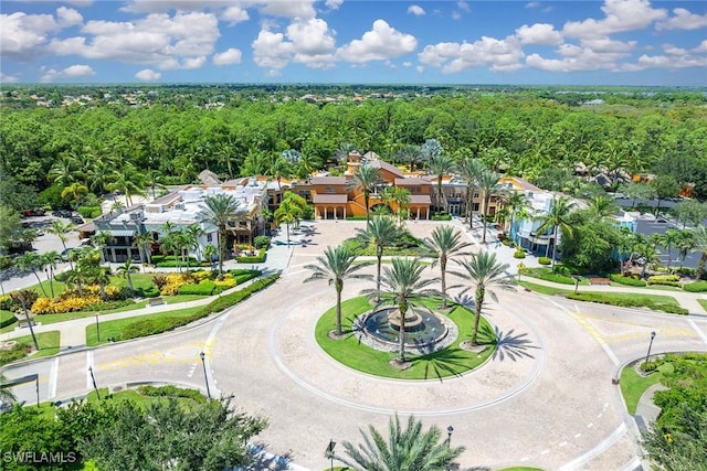 9134 Chula Vista St Unit 125, Naples, FL 34113 - birds eye view of property with a view of trees and a residential view