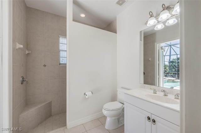 5072 Kensington High St, Naples, FL 34105 - bathroom featuring a tile shower, tile patterned flooring, visible vents, toilet, and vanity