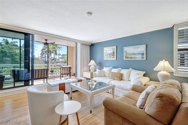 3100 Gulf Shore Blvd N Unit 103, Naples, FL 34103 - living area featuring wood finished floors, expansive windows, and crown molding