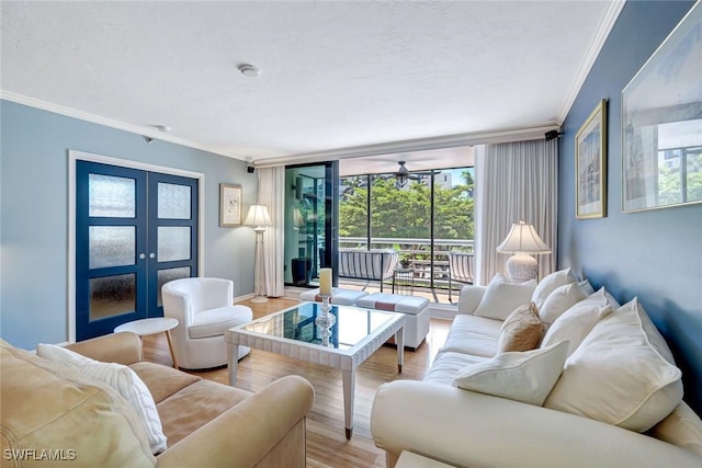 3100 Gulf Shore Blvd N Unit 103, Naples, FL 34103 - living area with ornamental molding, light wood finished floors, french doors, ceiling fan, and baseboards