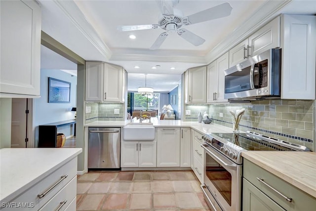 3100 Gulf Shore Blvd N Unit 103, Naples, FL 34103 - kitchen featuring stainless steel appliances, ceiling fan, a sink, recessed lighting, and light countertops