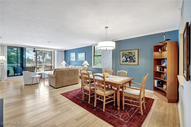 3100 Gulf Shore Blvd N Unit 103, Naples, FL 34103 - dining space featuring light wood-type flooring, baseboards, and ornamental molding