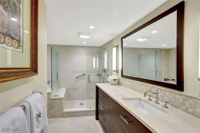 3100 Gulf Shore Blvd N Unit 103, Naples, FL 34103 - full bathroom featuring a stall shower, vanity, recessed lighting, backsplash, and tile patterned floors