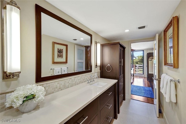 3100 Gulf Shore Blvd N Unit 103, Naples, FL 34103 - bathroom featuring vanity, decorative backsplash, recessed lighting, and tile patterned flooring