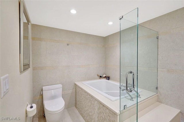 3100 Gulf Shore Blvd N Unit 103, Naples, FL 34103 - full bath featuring tile walls, a bath, a tile shower, and toilet