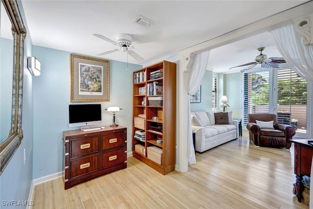 3100 Gulf Shore Blvd N Unit 103, Naples, FL 34103 - living room featuring ceiling fan, light wood-style flooring, and baseboards