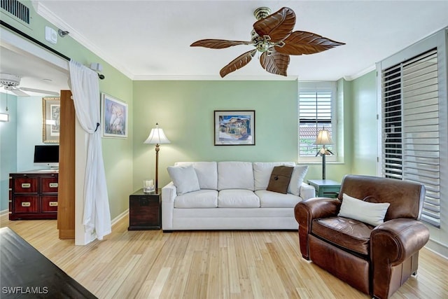 3100 Gulf Shore Blvd N Unit 103, Naples, FL 34103 - living area featuring a ceiling fan, wood finished floors, crown molding, and baseboards