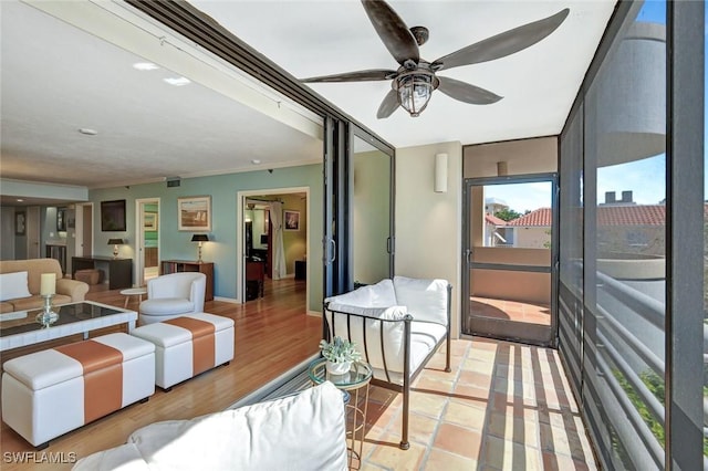 3100 Gulf Shore Blvd N Unit 103, Naples, FL 34103 - living area featuring ceiling fan, ornamental molding, and light wood-style floors