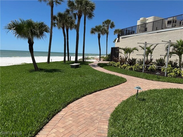 3100 Gulf Shore Blvd N Unit 103, Naples, FL 34103 - surrounding community with a lawn and view of water and beach