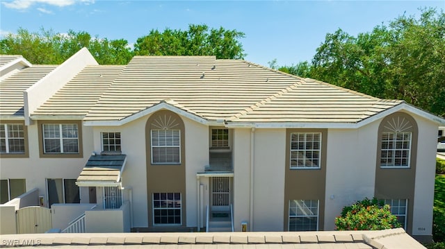 3770 Fieldstone Blvd Unit 1508, Naples, FL 34109 - back of house featuring stucco siding and a tiled roof