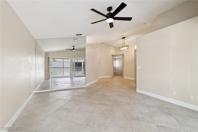 3770 Fieldstone Blvd Unit 1508, Naples, FL 34109 - unfurnished room with lofted ceiling, a ceiling fan, baseboards, and light tile patterned floors