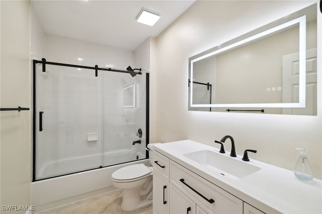 3770 Fieldstone Blvd Unit 1508, Naples, FL 34109 - bathroom with vanity, tile patterned flooring, bath / shower combo with glass door, and toilet